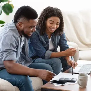 Man and woman working on finances