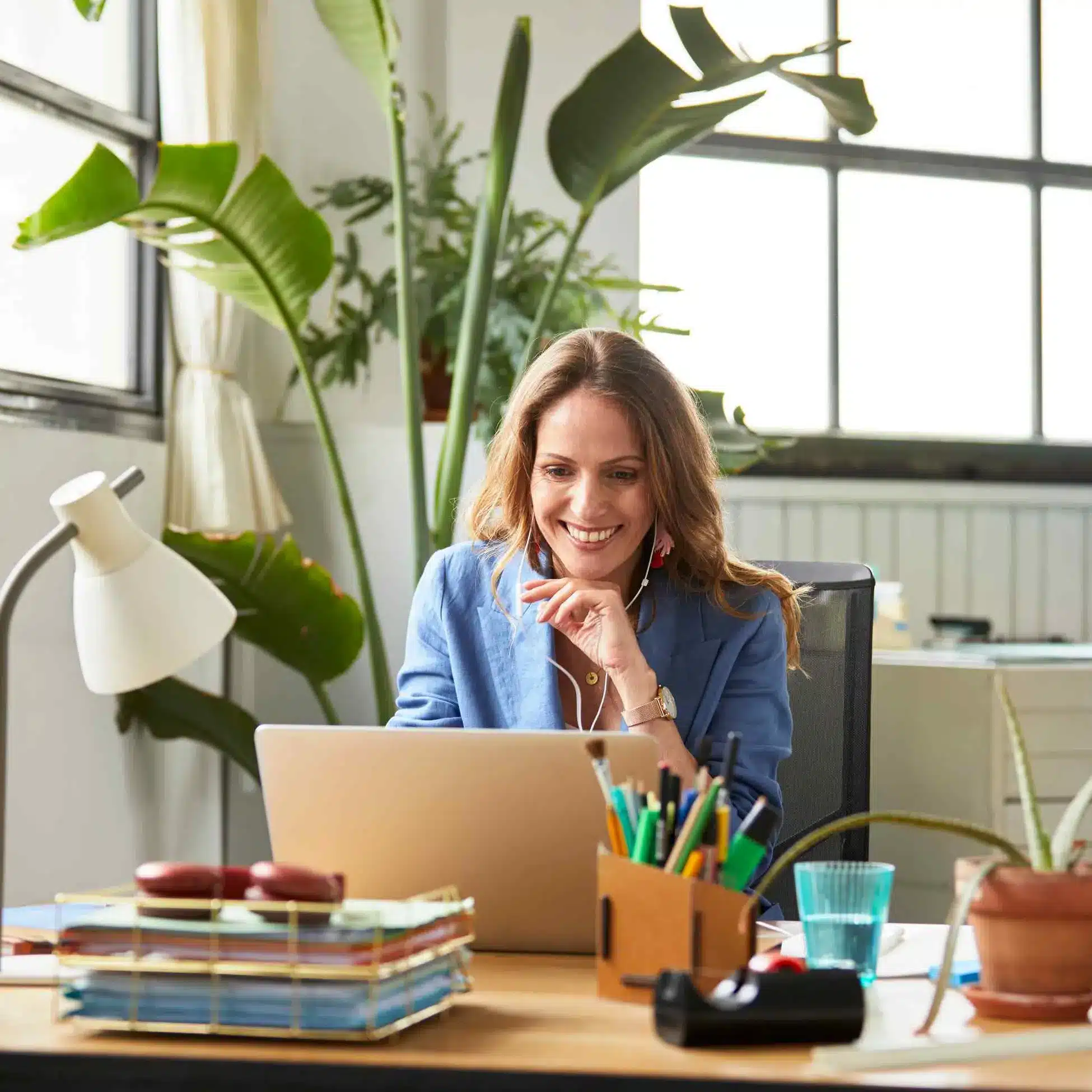 Woman smiling using laptop