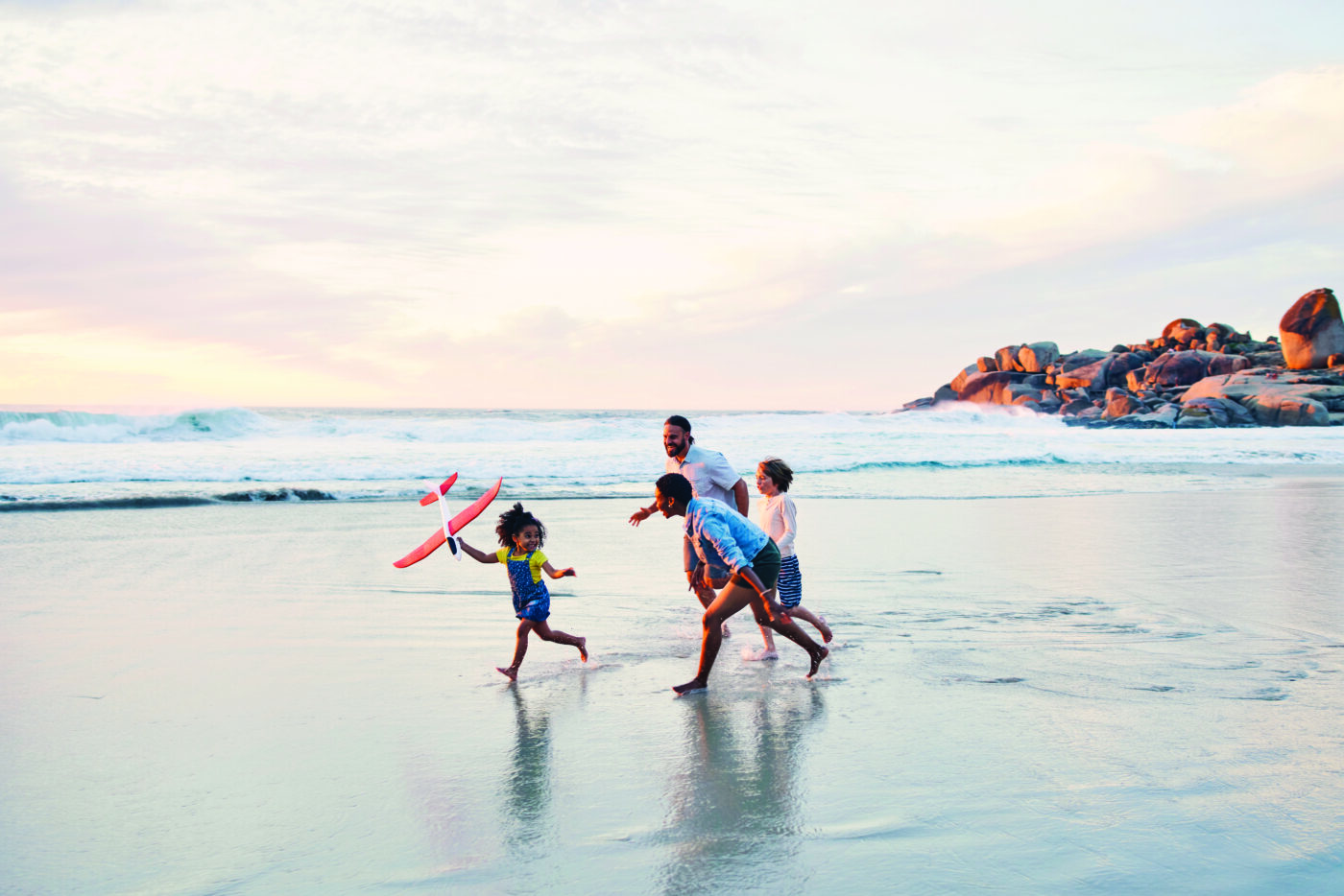 Happy family enjoying the beach