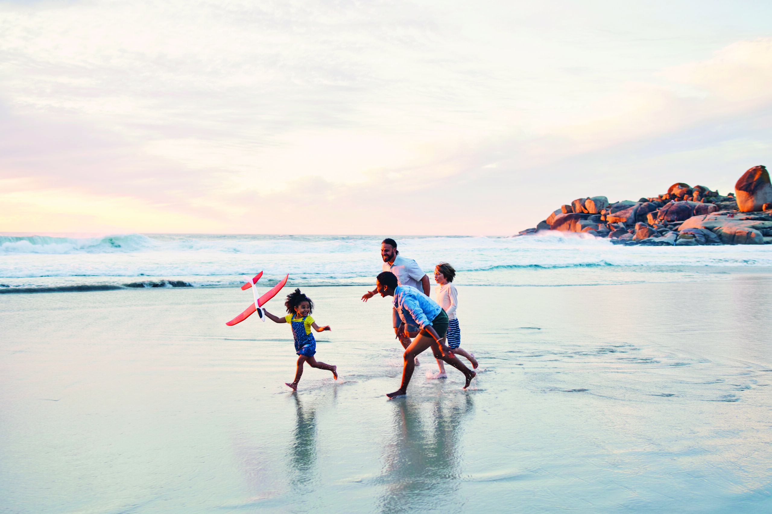 Happy family enjoying the beach