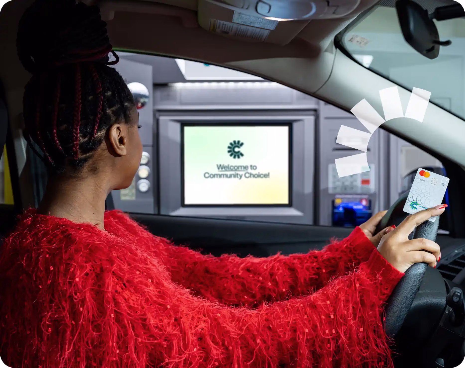 A woman at an atm pulling out Express Cash from Community Choice Credit Union