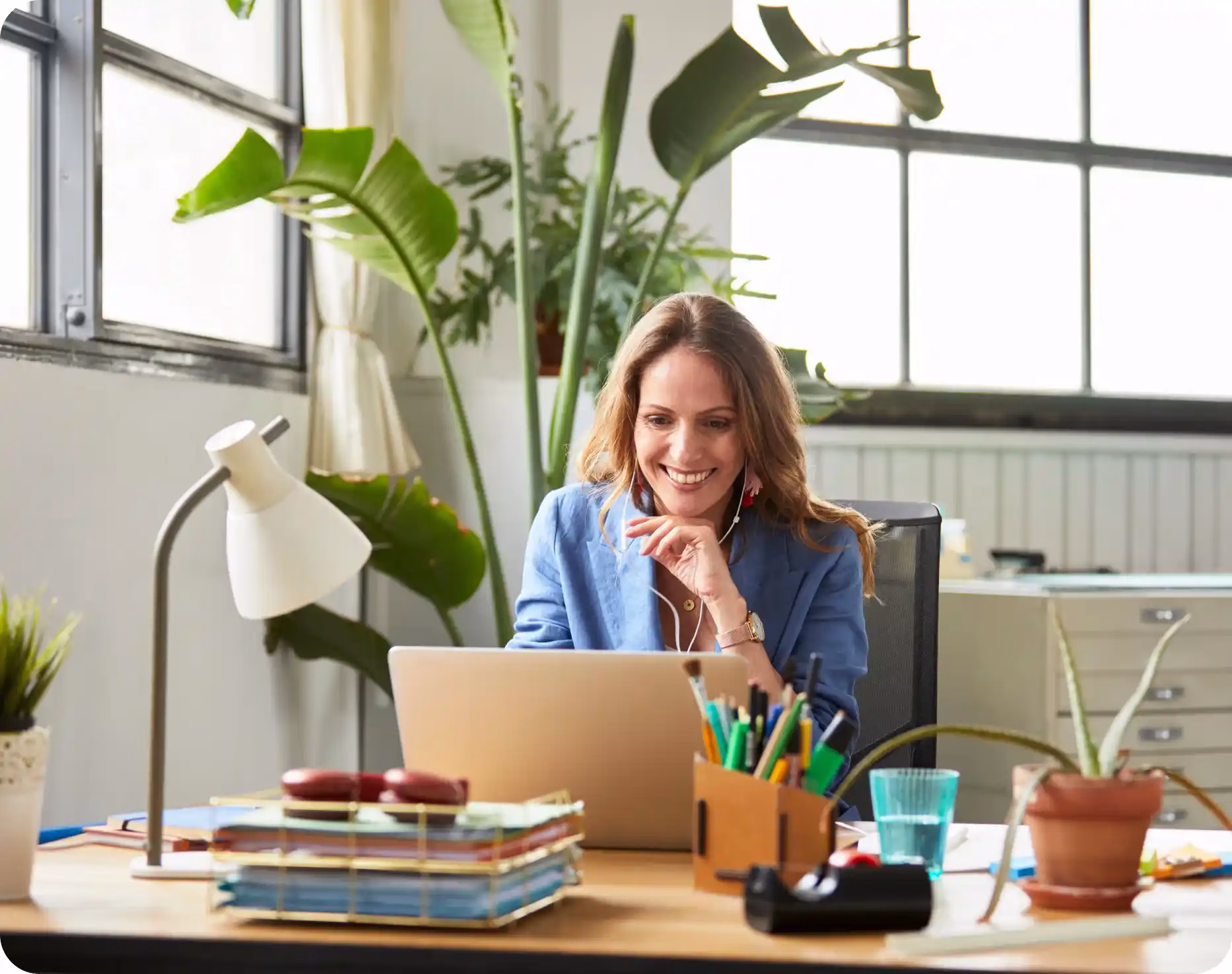 A woman at her desk looking into Community Choice's credit union trust