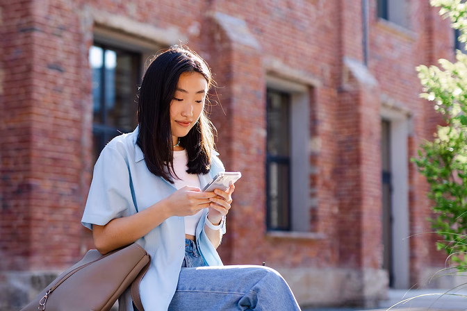 A teen calls member services at Community Choice Credit Union after graduation