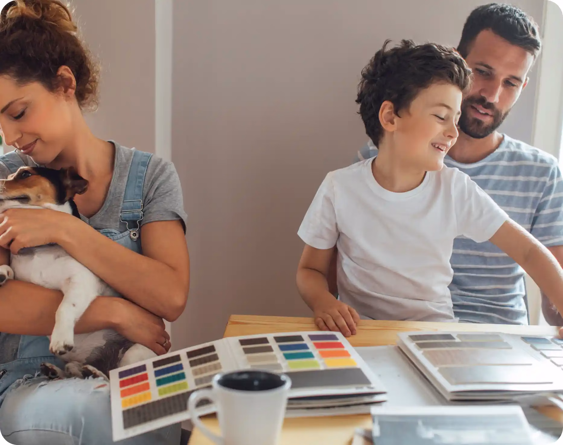 A family picking out paint colors for their new home with the help of CCCU loans