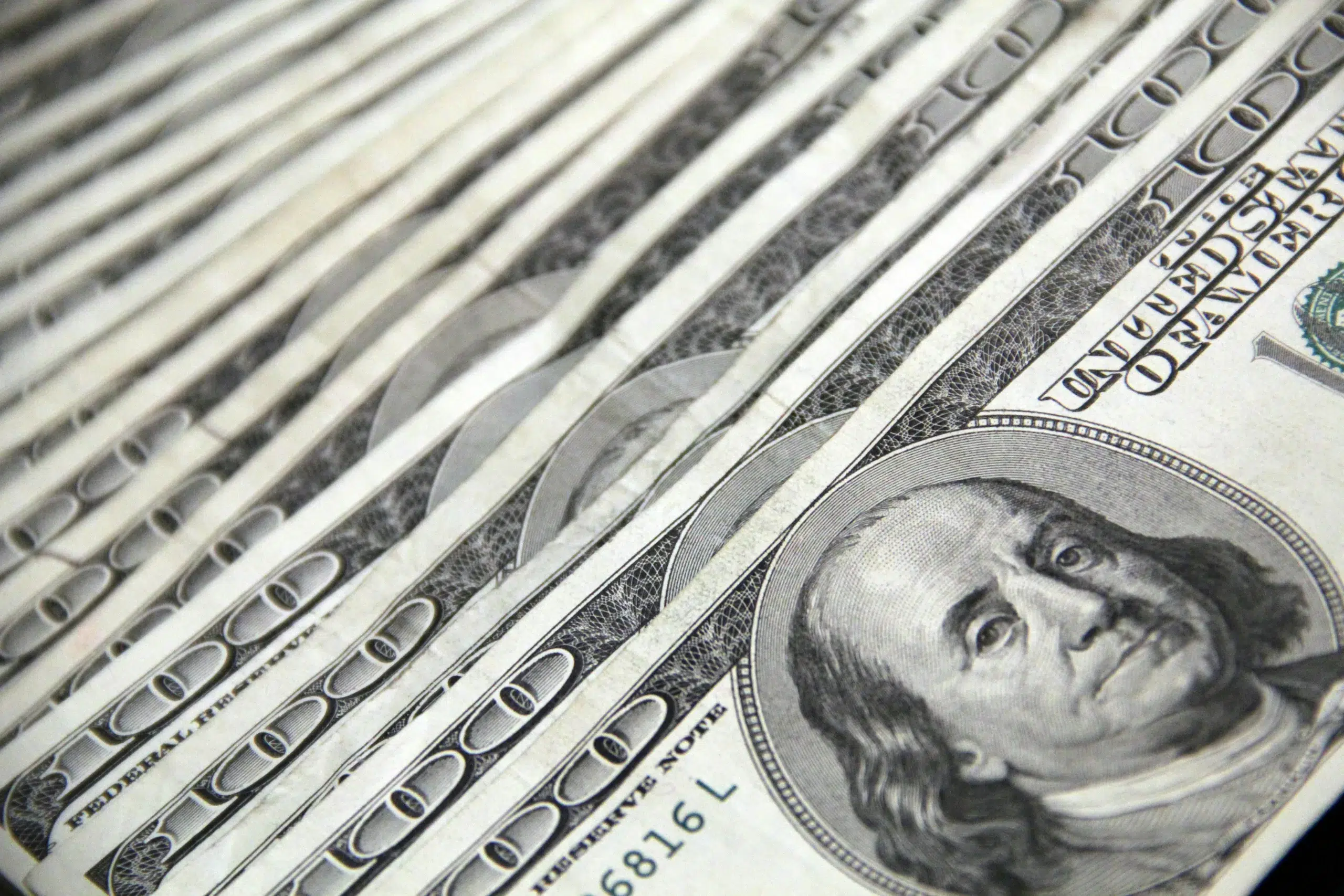$100 bills fanned out.