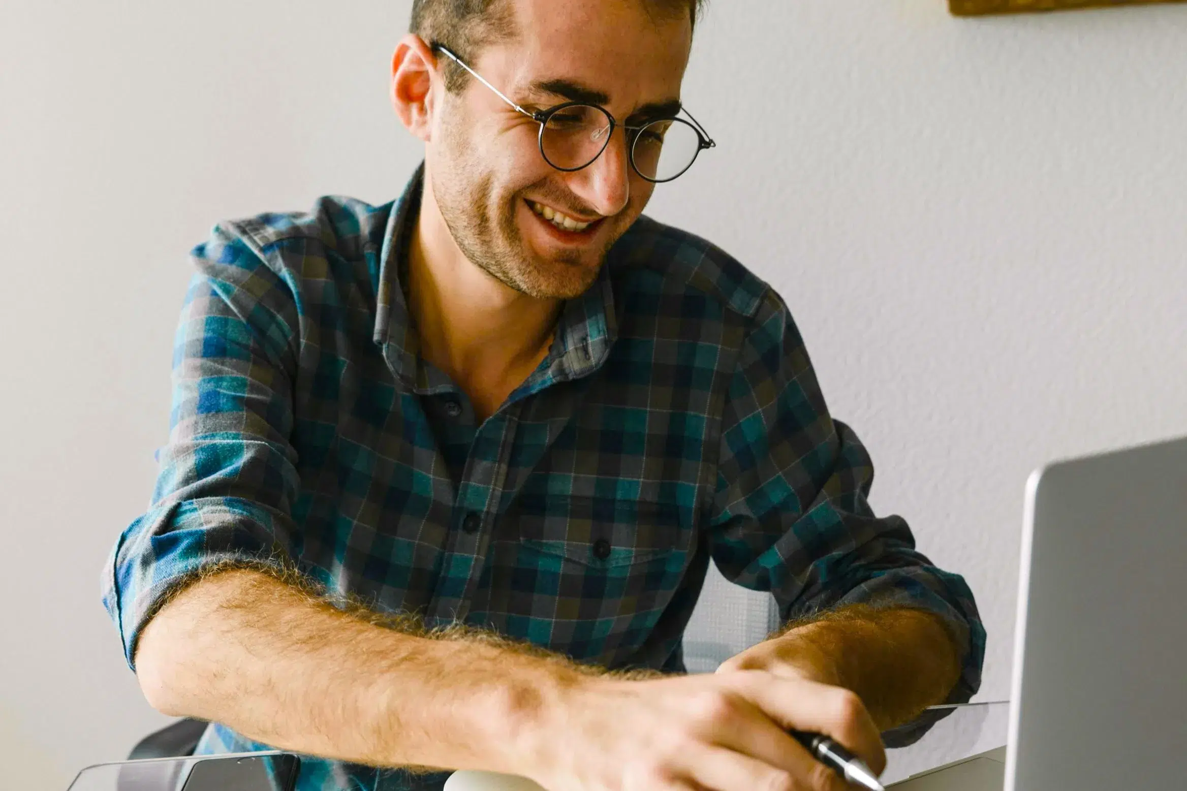 Man typing on computer - Community Choice Credit Union