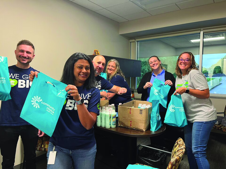 Volunteers assembling hygiene kits with Community Choice Credit Union
