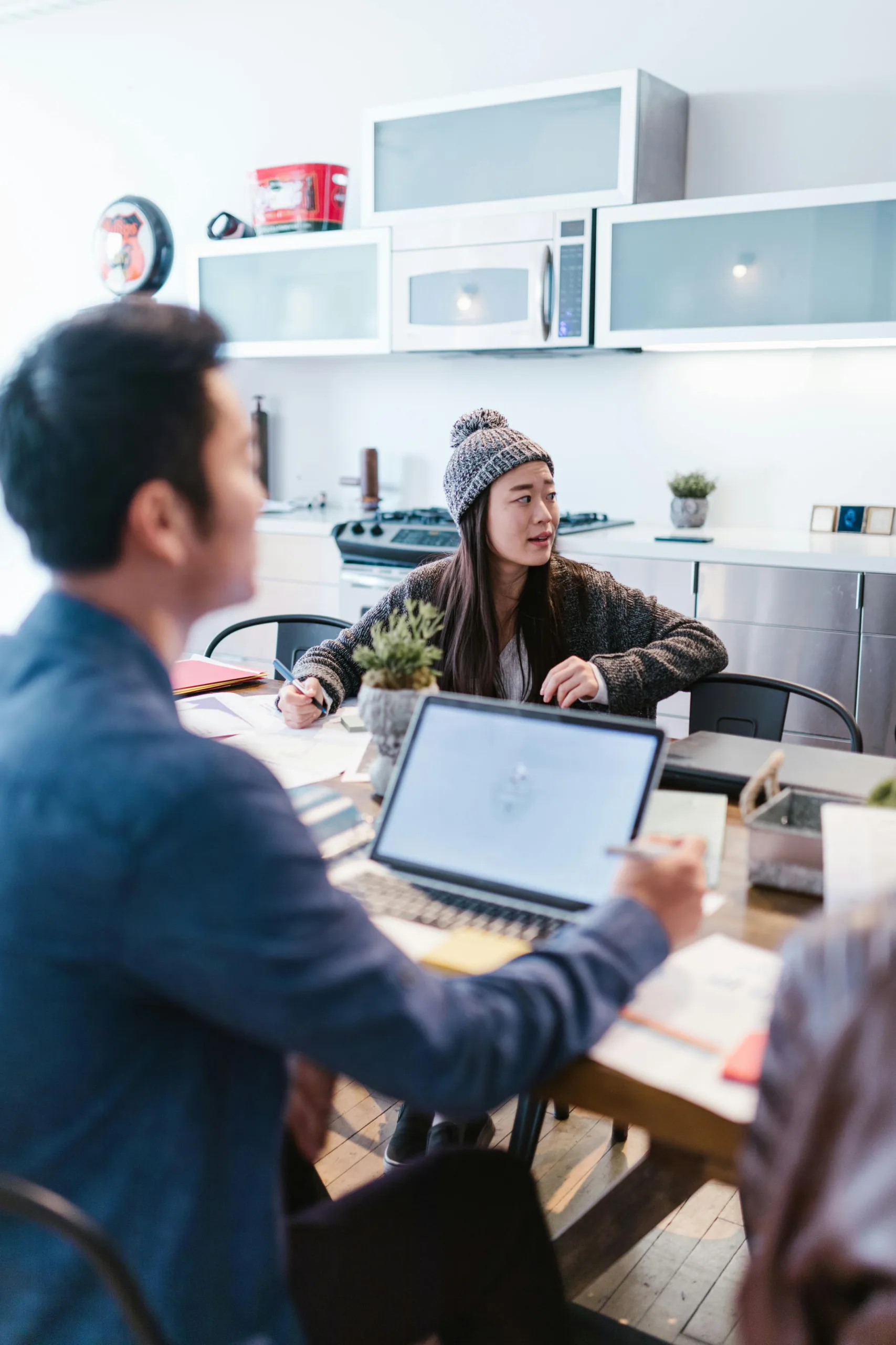 A man and woman work in their office.