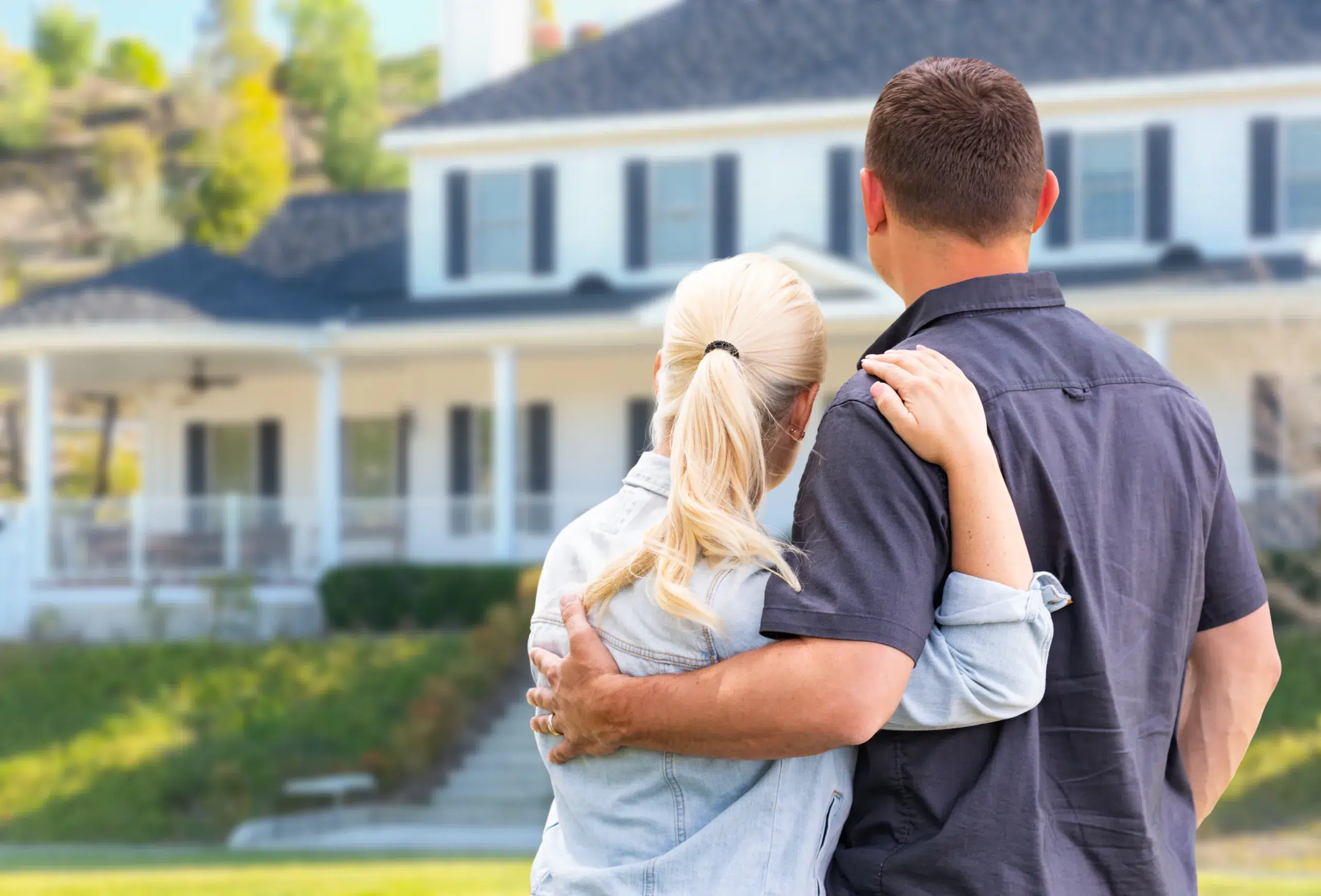 A young couple consider buying a new home in Michigan - Community Choice Credit Union