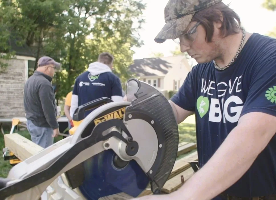 A Community Choice member lends his sawing skills to give big.