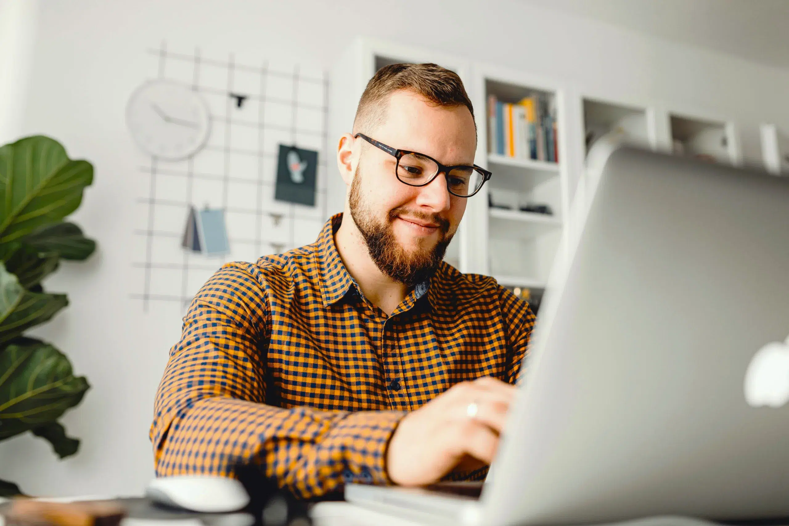 Business man on a laptop - community choice credit union