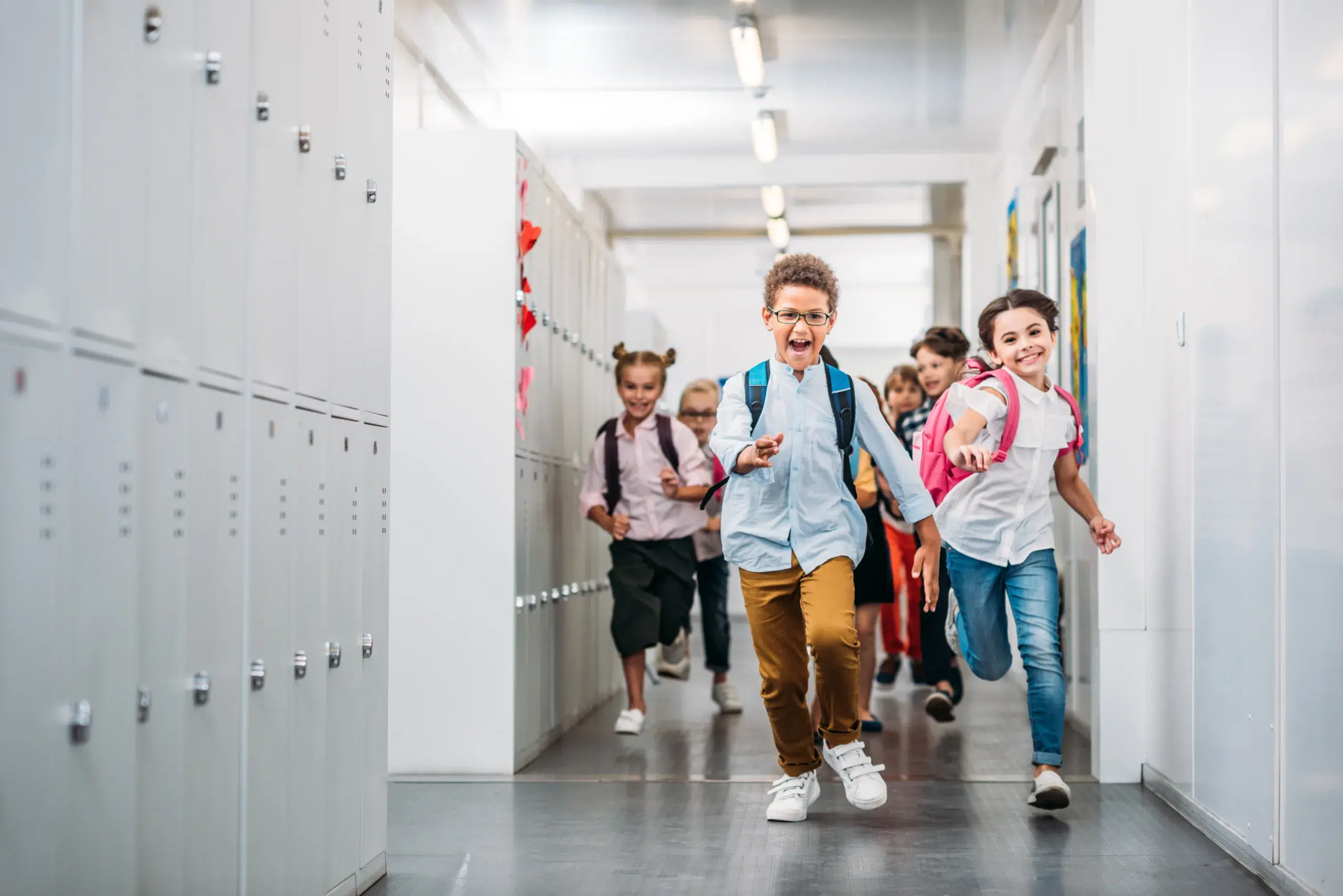 Children running in the hallway at school - Community Choice Credit Union