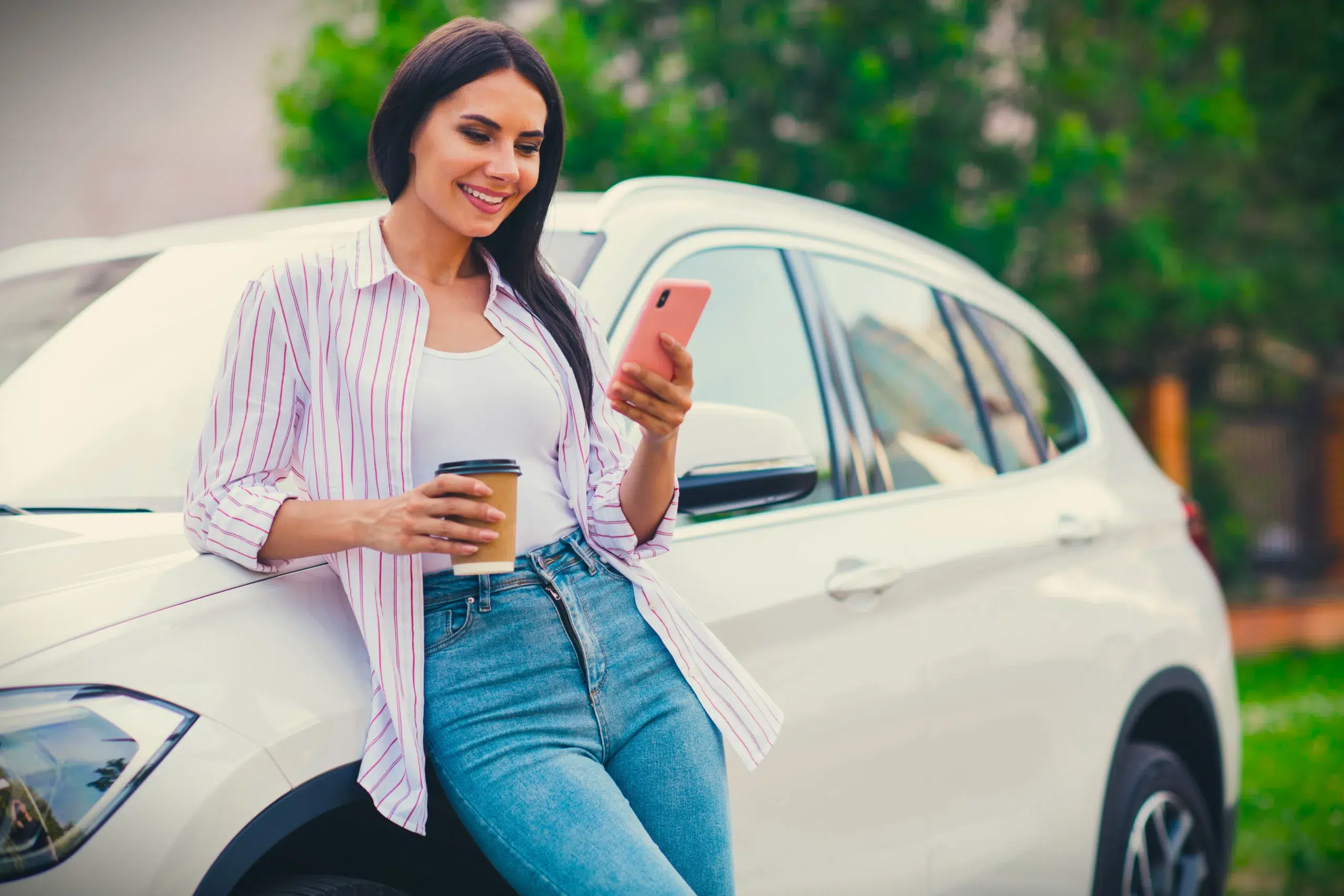 A woman enjoying her car and easy banking with Community Choice Credit Union