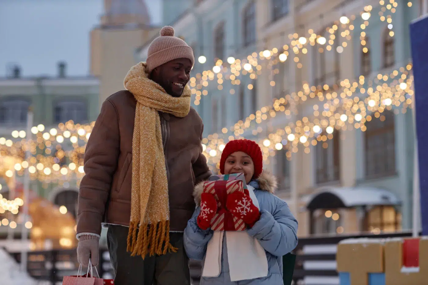A father and daughter enjoy holiday shopping. Community Choice Credit Union