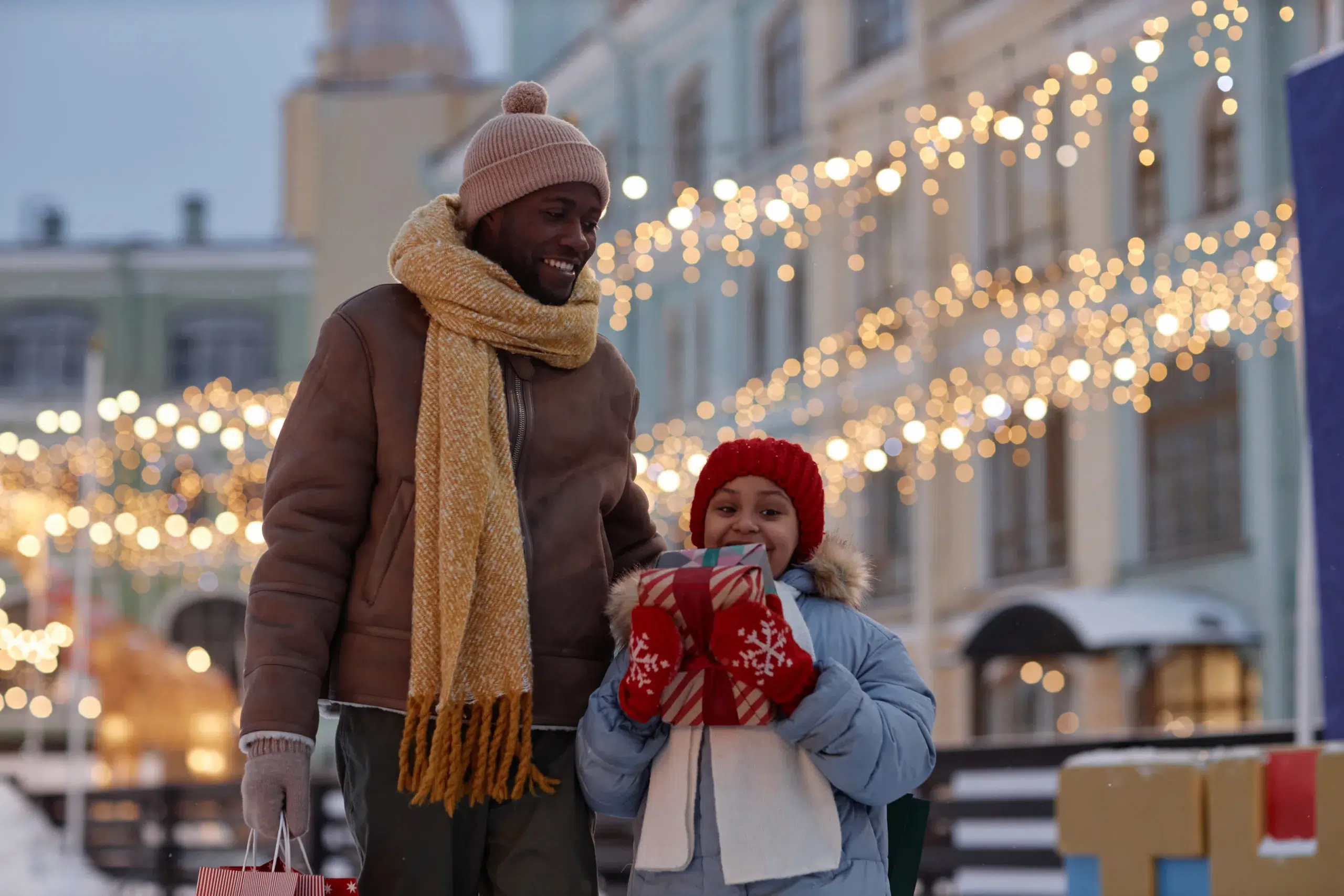A father and daughter enjoy holiday shopping. Community Choice Credit Union